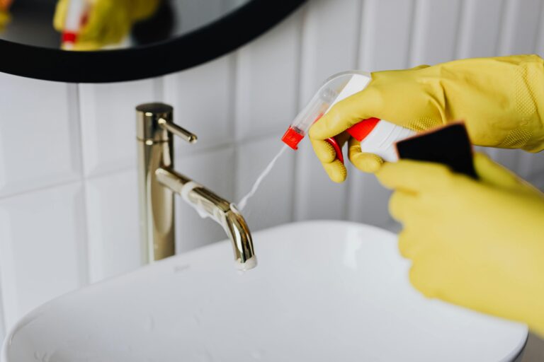 The Cleaners cleaning a bathroom sink